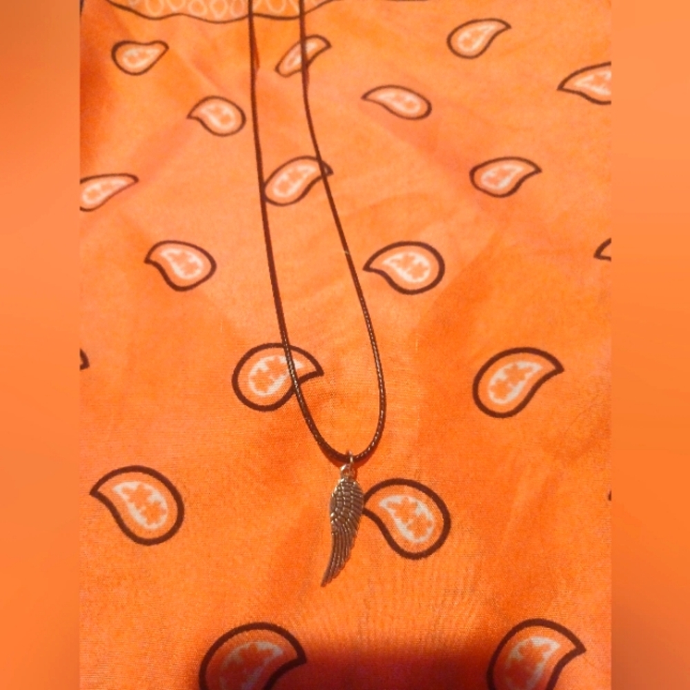 Black cord necklace with wing charm